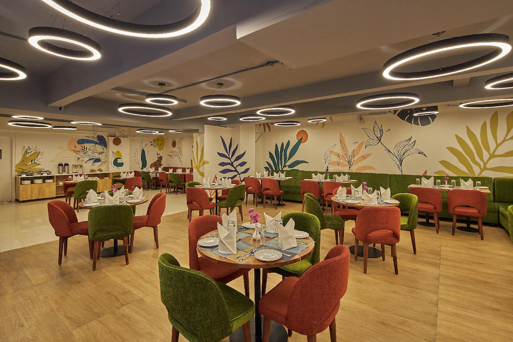 Elegant banquet hall with round tables and chandelier lighting