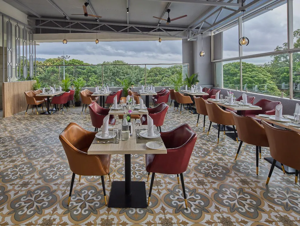 Elegant banquet hall with round tables and chandelier lighting