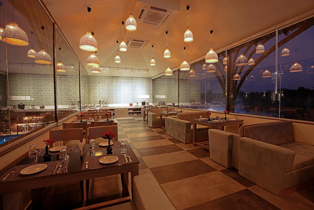 Elegant banquet hall with round tables and chandelier lighting